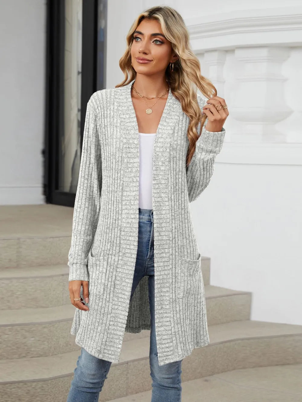 Autumn and winter long color long sleeved loose pocket cardigan jacket for women