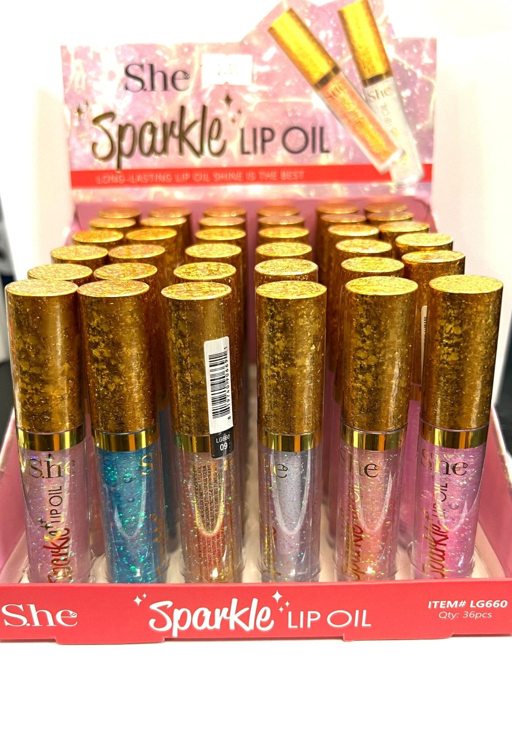 S.HE SPARKLE LIP OIL